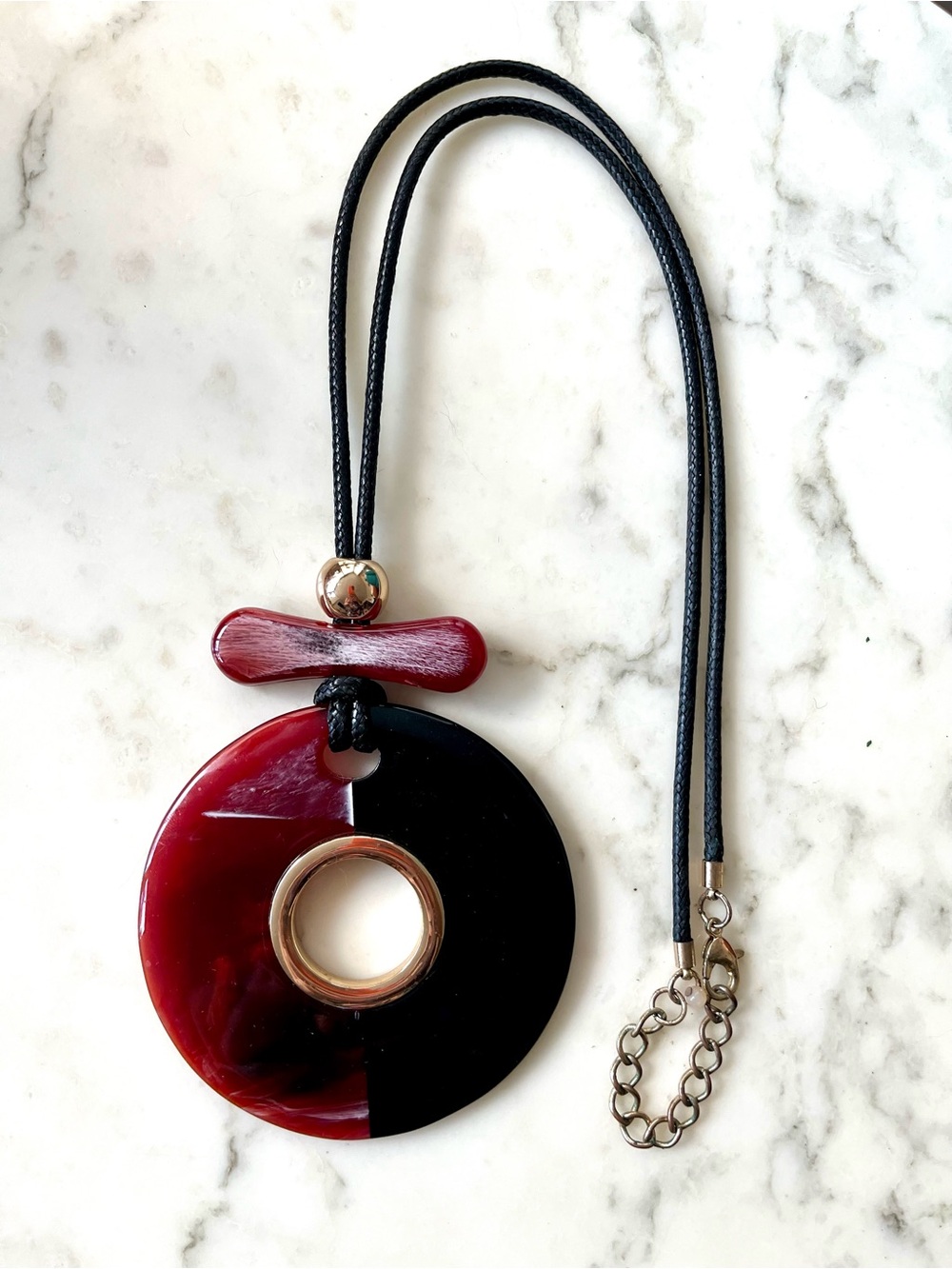 Large round black and burgundy acrylic pendant necklace